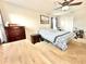 Inviting bedroom with carpet flooring, a ceiling fan, and a large dresser with decorative accents at 16334 Saint Augustine St, Clermont, FL 34714
