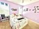 Comfortable bedroom includes decor, a plush rug, and natural light from two sunny windows at 16334 Saint Augustine St, Clermont, FL 34714