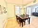 Traditional dining room featuring a marble table, chandelier lighting, and neutral paint colors at 16334 Saint Augustine St, Clermont, FL 34714