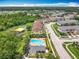 Aerial view of community, showcasing pool, playground, and well-maintained townhome residences at 16724 Cedar Crest Dr, Orlando, FL 32828