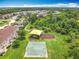 Aerial view of the community playground, set amongst lush trees in a residential neighborhood at 16724 Cedar Crest Dr, Orlando, FL 32828