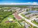 Expansive aerial view of residential community, featuring pool, playground, lake, and townhome residences at 16724 Cedar Crest Dr, Orlando, FL 32828