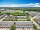 Extensive aerial view of residential townhouses and a sports complex on a sunny day at 16724 Cedar Crest Dr, Orlando, FL 32828