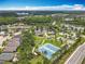 Community aerial view of park with tennis courts, playgrounds, basketball, fountain pond and green spaces and sidewalks at 16724 Cedar Crest Dr, Orlando, FL 32828