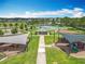 Aerial view of community park offering playground, tennis courts and picnic pavilions for outdoor recreation at 16724 Cedar Crest Dr, Orlando, FL 32828
