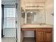 Bathroom vanity with drawers, mirror and lighting, and separate toilet and shower area at 16724 Cedar Crest Dr, Orlando, FL 32828