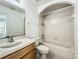 This bathroom features a vanity and a shower-tub combination for convenience at 16724 Cedar Crest Dr, Orlando, FL 32828