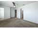 A spacious bedroom includes a ceiling fan and multiple doorways for a variety of configurations at 16724 Cedar Crest Dr, Orlando, FL 32828