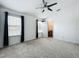 Spacious bedroom includes a ceiling fan, plenty of natural light, and an ensuite bathroom at 16724 Cedar Crest Dr, Orlando, FL 32828