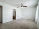 This expansive bedroom includes a ceiling fan and an ensuite bathroom with plenty of space at 16724 Cedar Crest Dr, Orlando, FL 32828