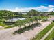 A community entrance sign next to pond and features manicured landscaping at 16724 Cedar Crest Dr, Orlando, FL 32828