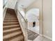 Warm entryway features carpeted stairs, arched doorways, and a view into the kitchen at 16724 Cedar Crest Dr, Orlando, FL 32828