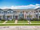 Charming townhomes with well-maintained lawns and colorful facades create a welcoming curb appeal at 16724 Cedar Crest Dr, Orlando, FL 32828