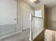 Second floor hallway features carpet flooring and provides access to bedrooms and bathrooms at 16724 Cedar Crest Dr, Orlando, FL 32828