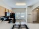 Bright kitchen featuring wood cabinets and modern black appliances with large windows at 16724 Cedar Crest Dr, Orlando, FL 32828