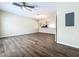 Spacious living room with hardwood floors and view of kitchen at 16724 Cedar Crest Dr, Orlando, FL 32828