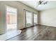 Bright living room with hardwood floors and views of the fenced courtyard at 16724 Cedar Crest Dr, Orlando, FL 32828