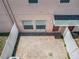 Aerial view of a private brick-paved patio area with white fences and entry door at 16724 Cedar Crest Dr, Orlando, FL 32828
