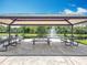 Community pavilion with picnic tables offers a relaxing outdoor space overlooking the scenic water fountain at 16724 Cedar Crest Dr, Orlando, FL 32828