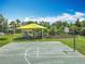 Community playground with a covered play area and a basketball court for outdoor recreation at 16724 Cedar Crest Dr, Orlando, FL 32828