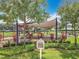 Well-maintained community playground in a landscaped area at 16724 Cedar Crest Dr, Orlando, FL 32828
