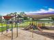 Community playground with multiple play structures, swings, slides, and shade covers for a fun outdoor experience at 16724 Cedar Crest Dr, Orlando, FL 32828