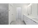 Stylish bathroom featuring sleek double vanity, grey tile, and modern fixtures at 16904 Sw 30Th Avenue Rd, Ocala, FL 34473