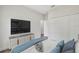 Cozy bedroom featuring modern furniture, a large television, and a spacious closet at 16904 Sw 30Th Avenue Rd, Ocala, FL 34473