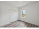 Bright bedroom features wood-look floors, and closet at 16904 Sw 30Th Avenue Rd, Ocala, FL 34473
