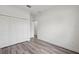 Bedroom features neutral walls, wood-look floors, and closet at 16904 Sw 30Th Avenue Rd, Ocala, FL 34473