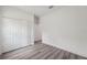 Bedroom features neutral walls, wood-look floors, and closet at 16904 Sw 30Th Avenue Rd, Ocala, FL 34473