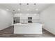 A bright and modern kitchen features a large island, stainless steel appliances, and modern cabinetry at 16904 Sw 30Th Avenue Rd, Ocala, FL 34473