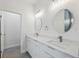 Bathroom showcasing double sinks, quartz counters, and modern lighting fixtures at 17139 Sw 44Th Cir, Ocala, FL 34473