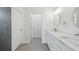Bright bathroom with double vanity sinks, quartz counters and modern finishes at 17139 Sw 44Th Cir, Ocala, FL 34473