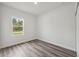 Bedroom featuring hard surface floors and a window for natural light at 17139 Sw 44Th Cir, Ocala, FL 34473