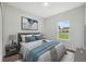 Comfortable bedroom with a queen-size bed, soft bedding, and natural light from the window at 17139 Sw 44Th Cir, Ocala, FL 34473