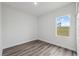 Bright bedroom featuring hard surface floors and a window for natural light at 17139 Sw 44Th Cir, Ocala, FL 34473