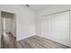 Bedroom featuring hard surface floors and a closet at 17139 Sw 44Th Cir, Ocala, FL 34473