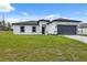 Charming one-story home featuring a two-car garage, landscaped yard, and modern architectural details at 17139 Sw 44Th Cir, Ocala, FL 34473