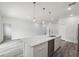Spacious kitchen features an island with a sink and stainless-steel appliances at 17139 Sw 44Th Cir, Ocala, FL 34473