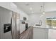 Spacious kitchen featuring stainless steel appliances, a large island, and abundant natural light at 17139 Sw 44Th Cir, Ocala, FL 34473