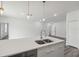 Kitchen island with sink and modern fixtures complemented by stainless steel appliances and ample counter space at 17139 Sw 44Th Cir, Ocala, FL 34473