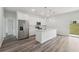 Modern kitchen with stainless steel appliances, island, and sliding glass door offers an open layout at 17139 Sw 44Th Cir, Ocala, FL 34473