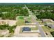 An aerial view of a quiet residential neighborhood with lush greenery and well-maintained homes at 17434 Sw 36Th Avenue Rd, Ocala, FL 34473