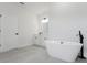 This primary bathroom features dual sinks, a soaking tub and a walk-in shower at 17434 Sw 36Th Avenue Rd, Ocala, FL 34473
