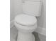 Close up of a crisp white toilet with gray tile flooring at 17434 Sw 36Th Avenue Rd, Ocala, FL 34473