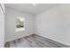 Bright bedroom with gray flooring, a large window, and a closet at 17434 Sw 36Th Avenue Rd, Ocala, FL 34473
