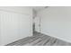 Bright bedroom featuring wood-look flooring and closet with bi-fold doors at 17434 Sw 36Th Avenue Rd, Ocala, FL 34473