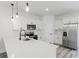 Bright kitchen with stainless steel appliances, white cabinets, and quartz countertops at 17434 Sw 36Th Avenue Rd, Ocala, FL 34473