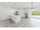 Spacious kitchen featuring white cabinets, stainless steel appliances, and an island at 17434 Sw 36Th Avenue Rd, Ocala, FL 34473